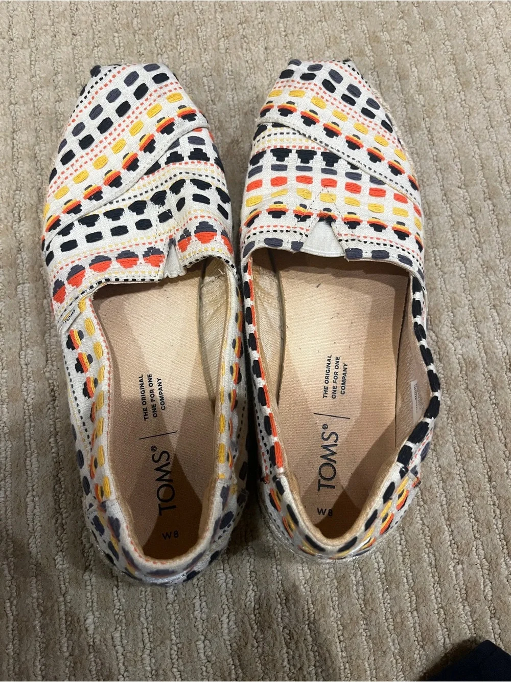 Toms Women Slip-On Canvas Shoes in White with Black, Yellow & Red Pattern